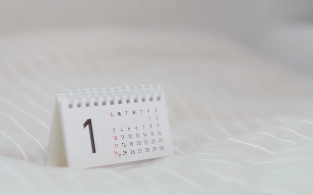 A desk calendar with deadlines marked
