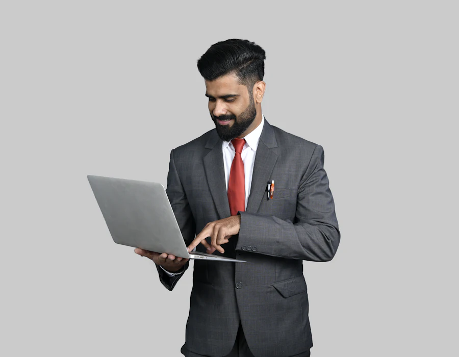 A tax professional working on a laptop