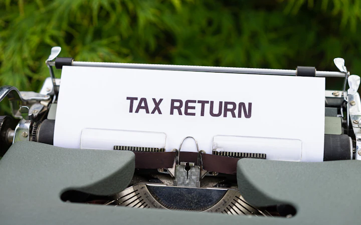 A tax return page in a typewriter
